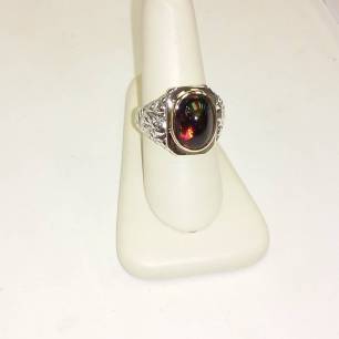 Silver and 14kt gold set with firery black opal