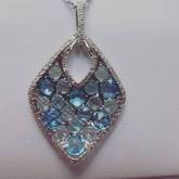 14Kt white gold set with diamonds and blue topaz