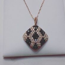 14 Kt Pink gold set with black and white diamonds